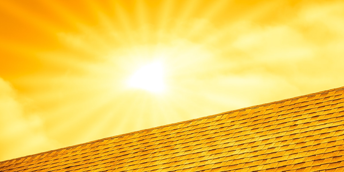 The sun shining brightly over a roof, highlighting the durability and heat resistance of impact-resistant shingles in New Orleans’ climate.