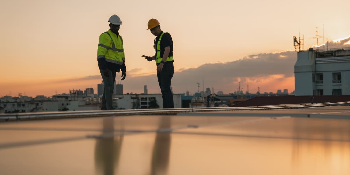Priority Roofing professionals inspecting a commercial roof in Louisiana to prepare for storm season and ensure proper maintenance.