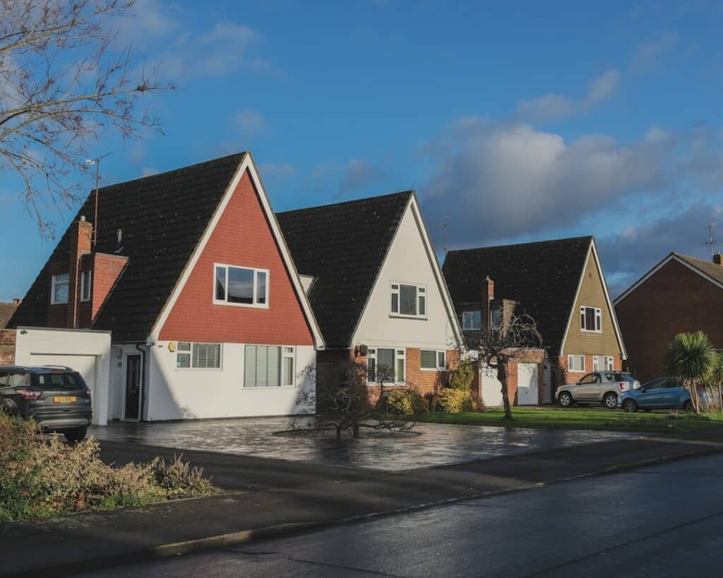Beautiful suburban home in Mandeville with a brand new, sturdy roof under a bright, sunny sky, representing the security a...