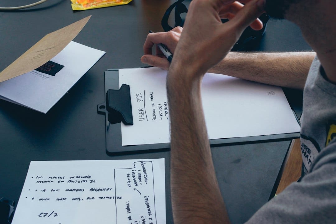 A close-up shot of a person's hand signing a contract on a clipboard, representing the critical moment a homeowner signs a potentially risky Assignment of Benefits agreement.